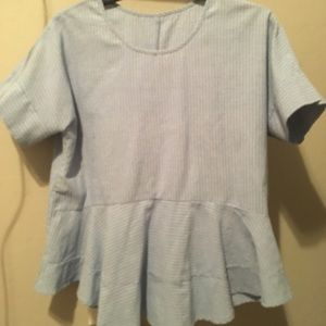 Blue and white striped peplume blouse.